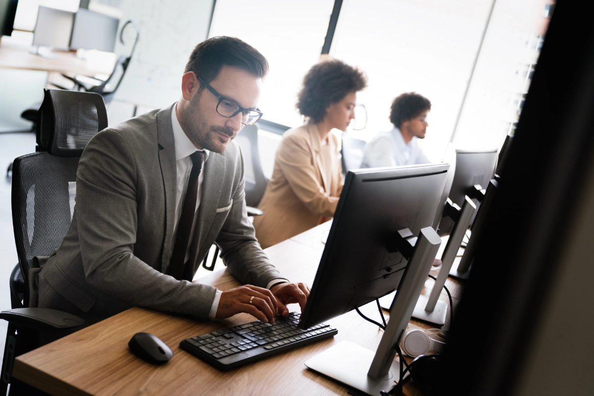 Close up of a group of office workers using computers