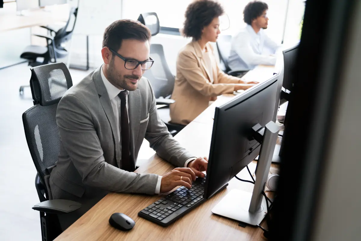 Close up of office workers using the computer typing